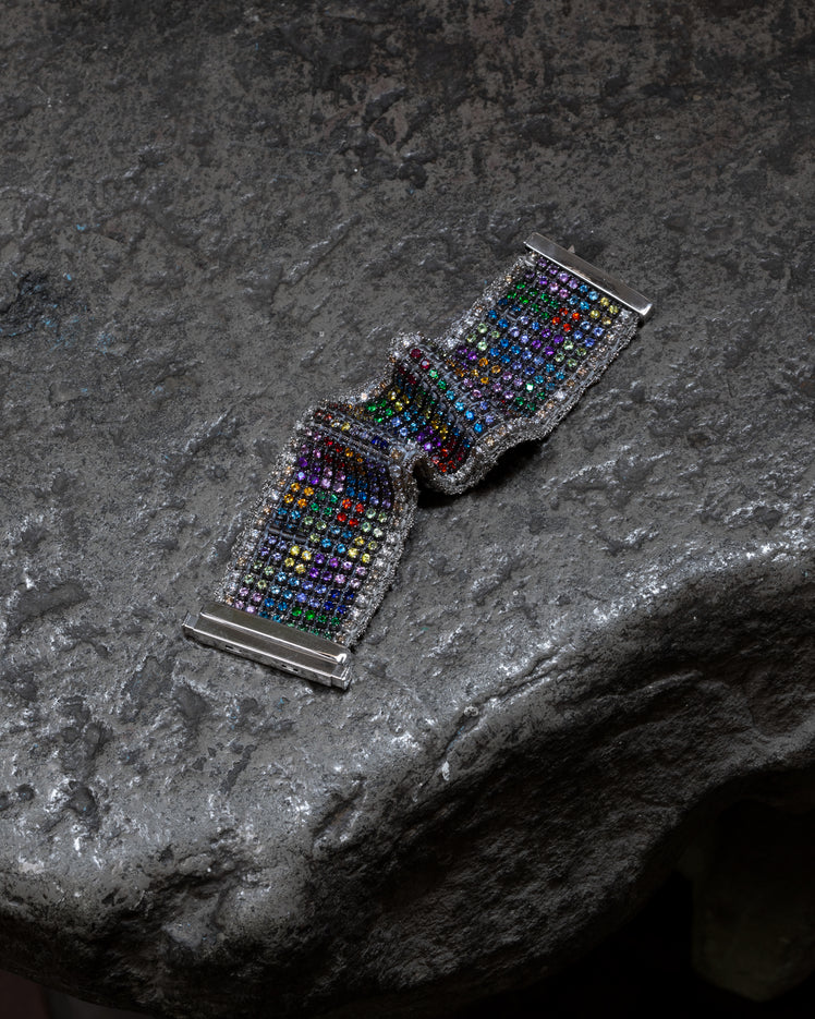 Rainbow Color Field bracelet on a stone bench in our Florence Atelier
