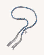 Silver balance lucky bracelet with balance charm on white background.