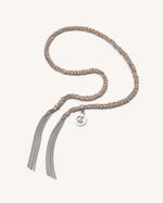 Silver Peace lucky bracelet with peace charm on white background.