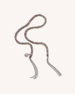 Silver Energy lucky bracelet with sun charm on white background.