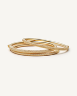 18k florentine frosted finish yellow gold thick bangles on white background
