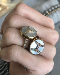 Carolina Bucci wearing two Zodia rings – Aries and Pisces.