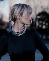 Carolina Bucci wearing 18k yellow Gold K.I.S.S. necklace, paired with an 1885 Links necklace.