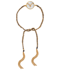 18k yellow gold diamond-cut chain, hand braided with grey silk, and a pavé grey diamond incrusted aries zodiac symbol on a mother of pearl medallion on a white background