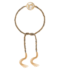 18k yellow gold diamond-cut chain, hand braided with grey silk, and a pavé grey diamond incrusted capricorn zodiac symbol on a mother of pearl medallion on a white background