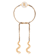 18k yellow gold diamond-cut chain, hand braided with grey silk, and a pavé grey diamond incrusted scorpio zodiac symbol on a mother of pearl medallion on a white background