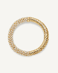18k yellow gold 180 twister luxe bracelet with shiny polished finish and pavé white diamonds on white background