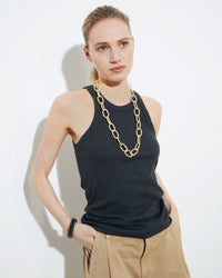 18k yellow gold florentine frosted finish 1885 grande links necklace styled with 18k black gold kiss bracelets