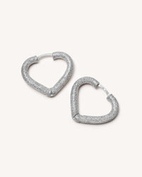 18k white florentine frosted finish gold cuore huggies earrings on white background