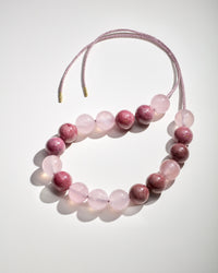 Bowery Downtown necklace including Rhodonite and Rose quartz semi precious spheres on white background