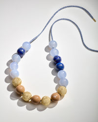 Greenwich village downtown necklace including Chalcedony and Lapis lazuli semi precious stones, camel coloured enamel spheres and 18k yellow gold florentine frosted finish spheres