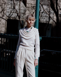 Nolita downtown necklace styled on model posing outside subway