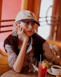 Soho downtown necklace styled with striped shirt and jumper and initial laboradite ring