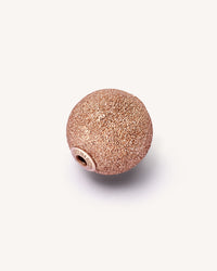 18k rose gold florentine frosted finish sphere on background