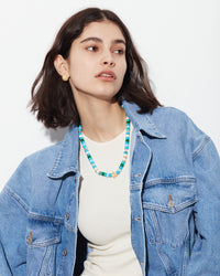 forte dei marmi forte beads necklace with 4 18k yellow florentine frosted finish gold beads and 18k yellow florntine frosted finish gold fiore pendant on white background modelled