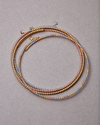 collection of 18k yellow, white and rose gold open beaded chokers