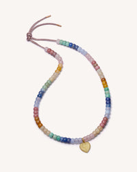 Holbox forte bead necklace with 18k yellow small florentine frosted finish gold cuore pendant on white background