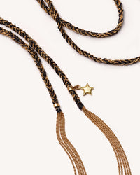 close up of 18k yellow gold health lucky necklace and 18k yellow gold star charm on white background