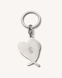 Back of 18k white gold love lucky keychain  on white background