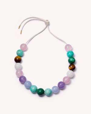Nolita downtown necklace including Amethyst, Chalcedony, Amazonite, Malachite, Tiger's eye, Rose quartz and White agate semi precious spheres on white background