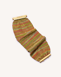 18K yellow gold and silk 5 cm woven bracelet on white background