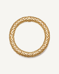 18k yellow gold shiny twister luxe bracelet on white background