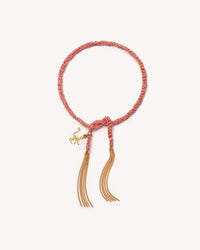 The colony 18k Yellow Gold lucky bracelet, tied with monkey charm on white background