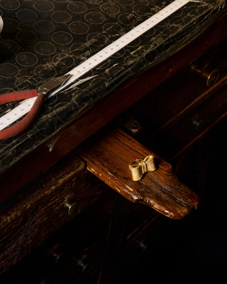 18k yellow florentine frosted finish gold tutto per te ring on atelier work bench