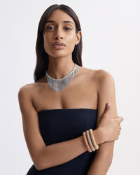 18k yellow, white and rose gold kiss bracelet modelled with 18k white gold fringe necklace