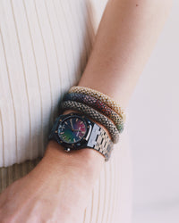 close up of 18k gold pavé twister luxe bracelets modelled with Audemars Piquet Black Ceramic Royal Oak