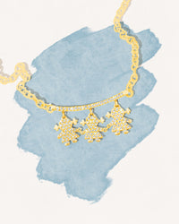 18k yellow gold 86cm rollὸ chain with an 18k yellow gold pendant designed in a pavé of precious stones on a white background illustration