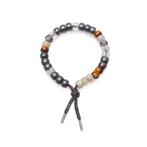 Judith Leiber forte beads bracelet with storm lurex tie cord with 18k white gold caps on white background