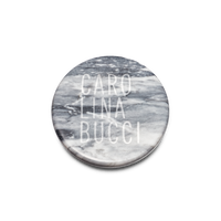 birds eye view of Carrara bardiglio marble coasters on white background