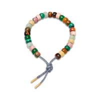 Londra forte beads bracelet with gunmetal lurex tie cord and 18k yellow gold caps on white background