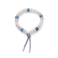 marfa forte beads bracelet with gunmetal cord with 18k white gold caps on white background