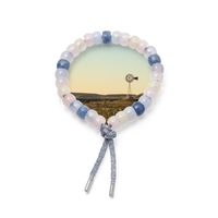 marfa forte beads bracelet with gunmetal cord with 18k white gold caps on white background