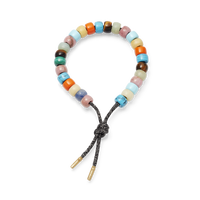 Carlotta forte beads bracelet with storm lurex tie cord and 18k yellow gold caps on white background