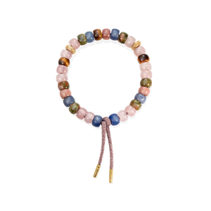 Saloni forte beads bracelet with 2 18k yellow gold florentine frosted finish bead and heather pink lurex tie cord with 18k yellow gold caps on white background