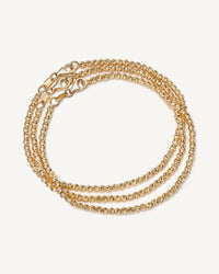 18k yellow gold discoball bracelet set on white background