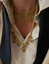 18k yellow florentine frosted finish gold beaded family necklace, modelled with a plain white shirt