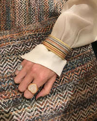 18k yellow, white and rose florentine frosted finish gold thick bangle set modelled with 18k florentine frosted finish pavé cuore ring