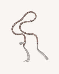 Silver Energy lucky bracelet with sun charm on white background.