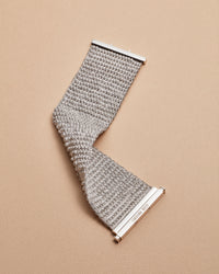 18k white gold beaded 4 cm woven bracelet on cream background