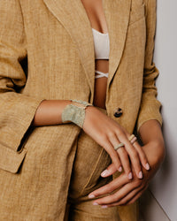 18k gold woven bracelet modelled with 18k gold woven rings 