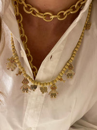 18k yellow florentine frosted finish gold beaded family necklace, modelled with a plain white shirt