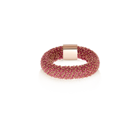 Pink woven slide ring made from woven silk and 18k rose gold on white background 