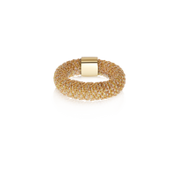 Beige woven slide ring made from woven silk and 18k yellow gold on white background 