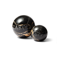 small and Large carrara Portoro marble sphere on white background 