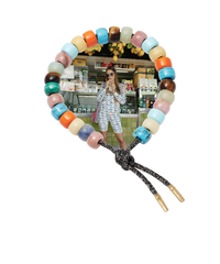 Carlotta forte beads bracelet with storm lurex tie cord and 18k yellow gold caps on white background